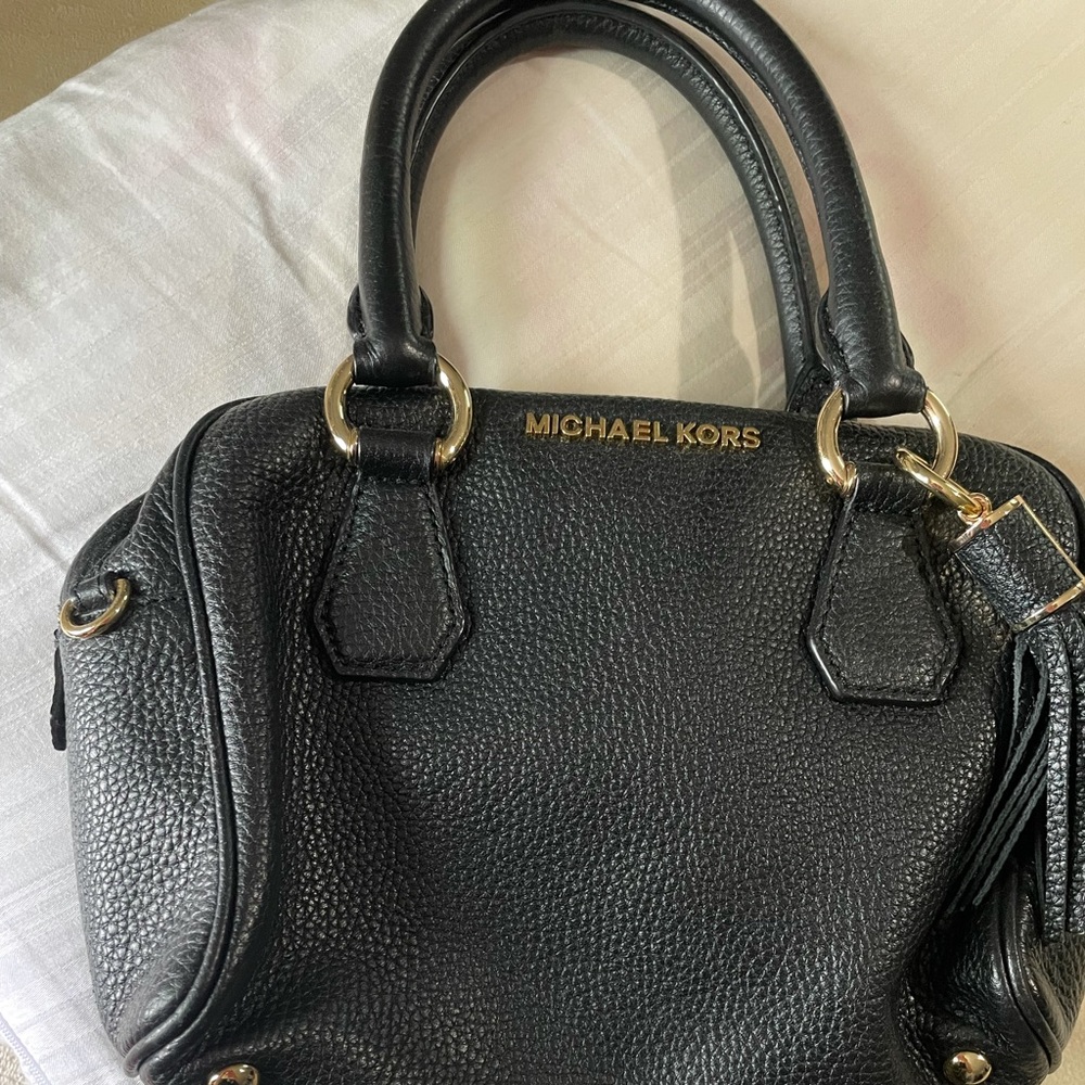 This is a small Leather MK bag.  Almost new.